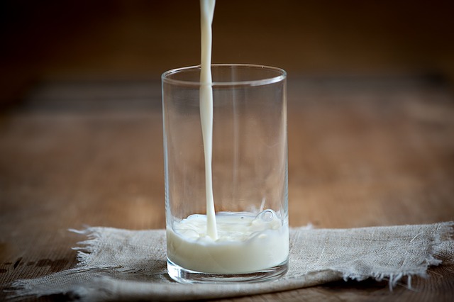 lactose intolerance milk pouring into glass